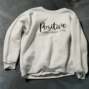 Size medium white positive saying sweater